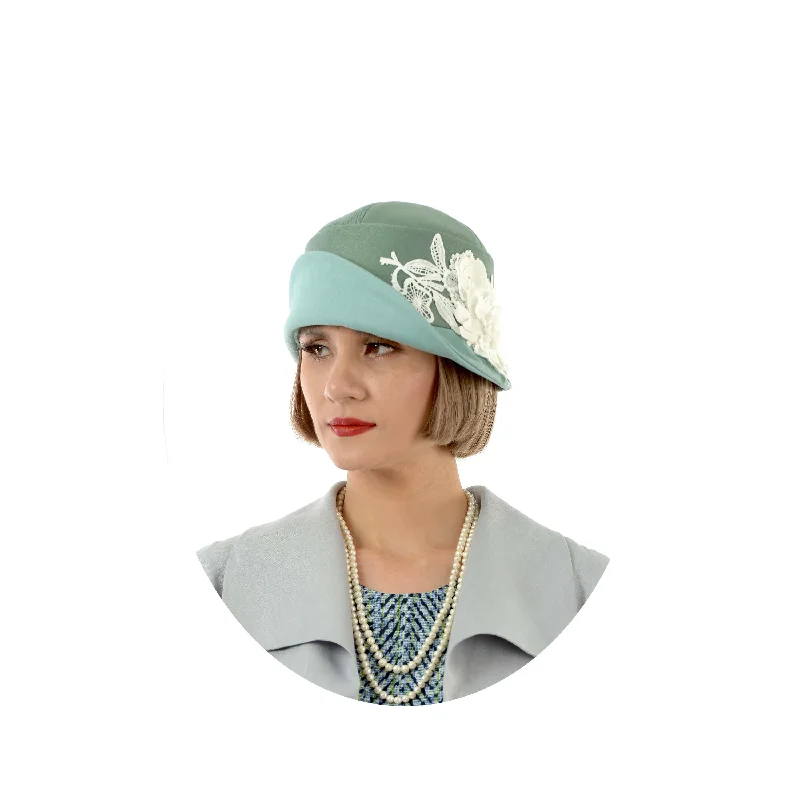 1920s-inspired linen cloche hat in muted green and pastel blue